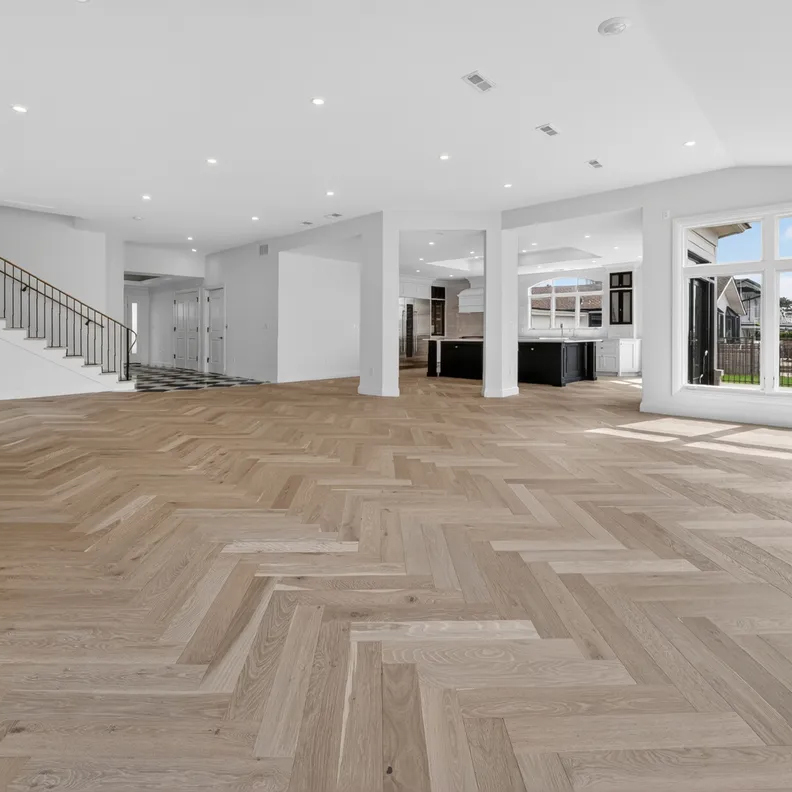 Prefinished White Oak Herringbone pattern installed with a direct glue on concrete slab.